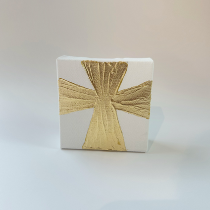 A 4x4 inch canvas with a wide gold painted cross, hand-painted on a white background, ready for gifting.
