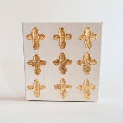 9 gold handpainted hearts on a 6 inch byt 6 inch canvas 